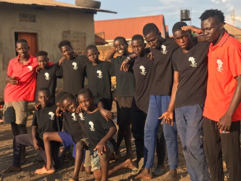 Group of people standing together looking at the camera