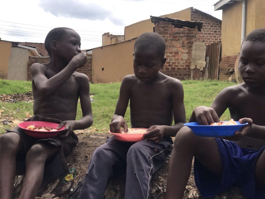 three boys eating together