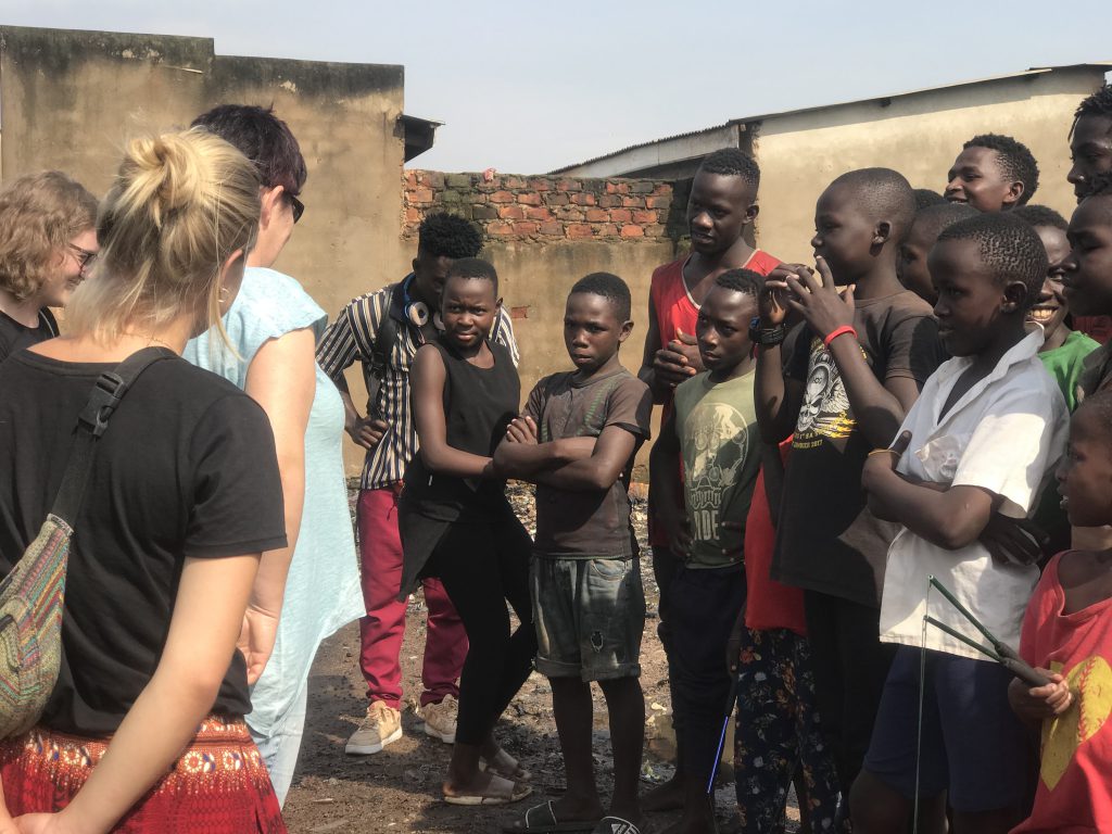 Volunteer and students talking in a semicircle