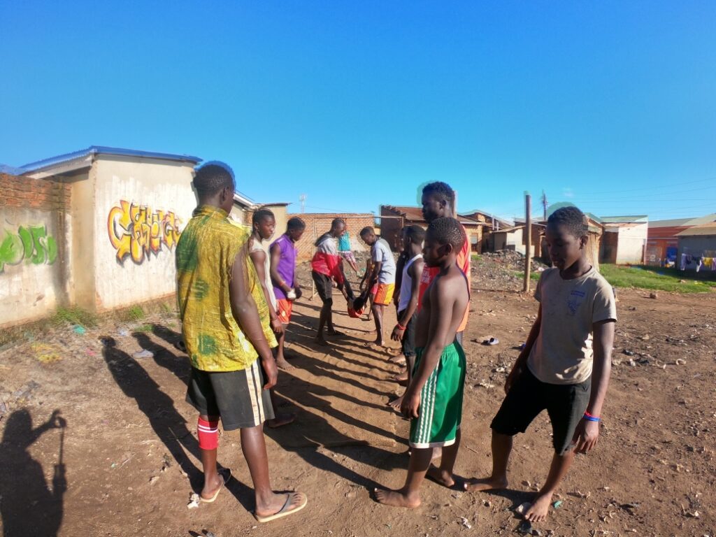 students standing engaging with one another